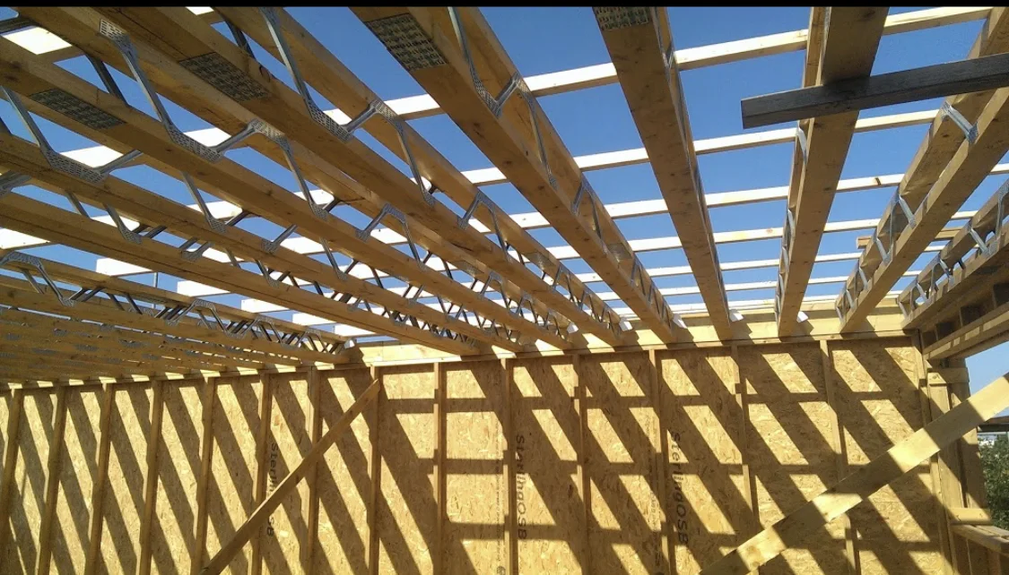 Engineered timber floor joists above framed walls