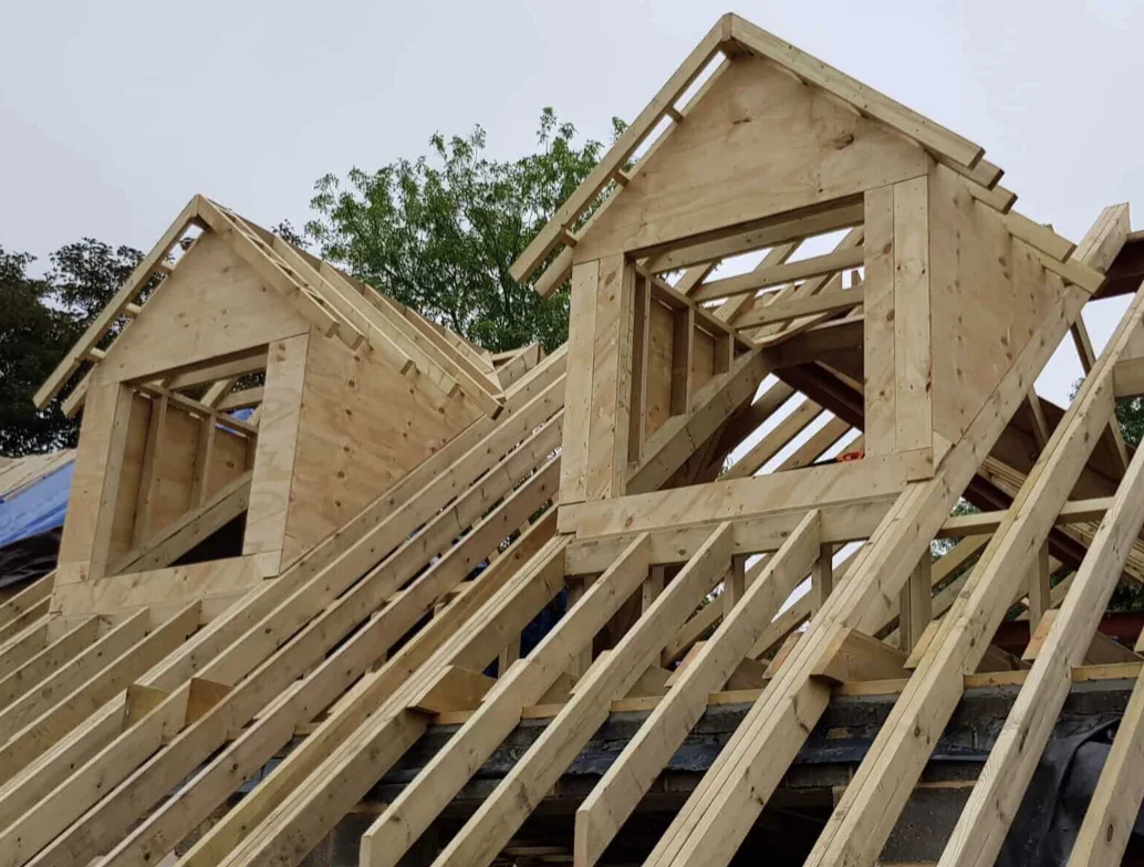 Cut roof carpentry with two timber dormer frames