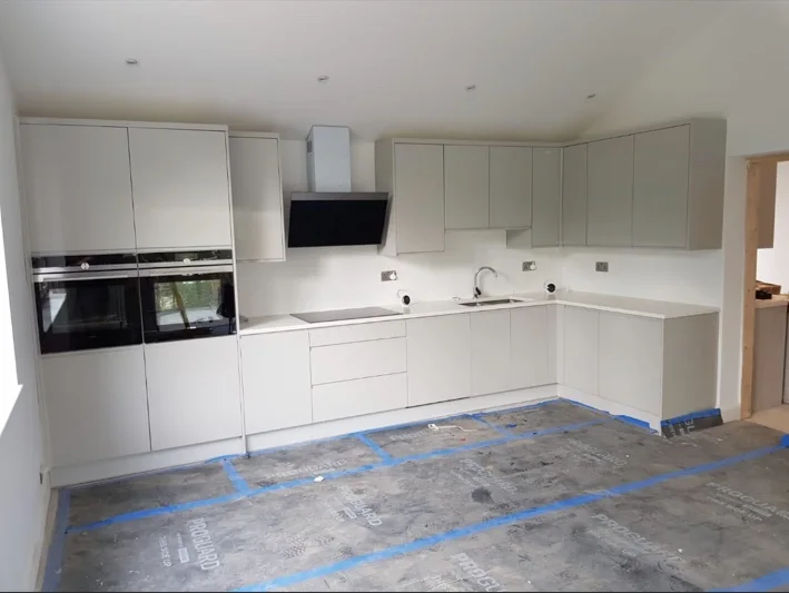White kitchen with tall oven units
