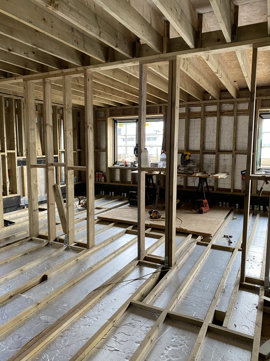 Interior timber stud partitions and floor framing