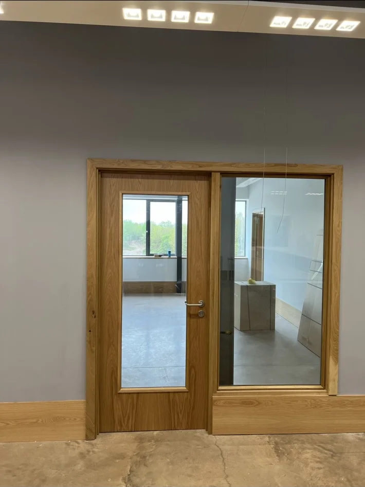 Timber door with adjacent glazed screen
