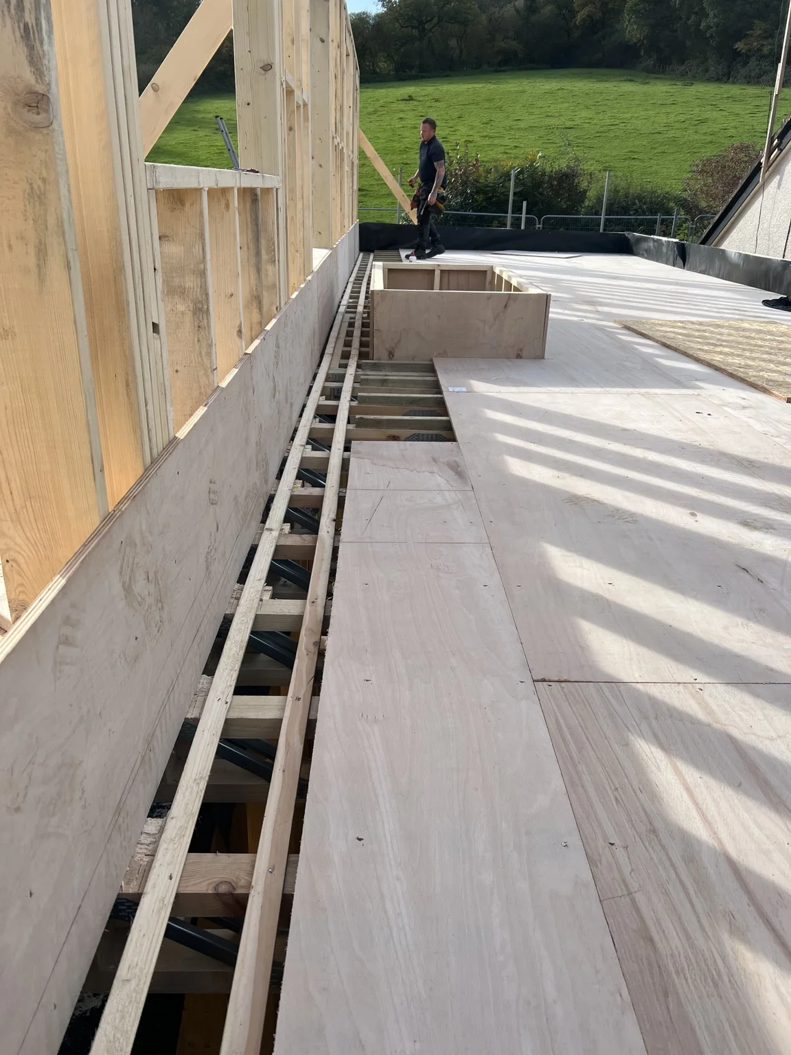 Floor decking beside timber wall framing