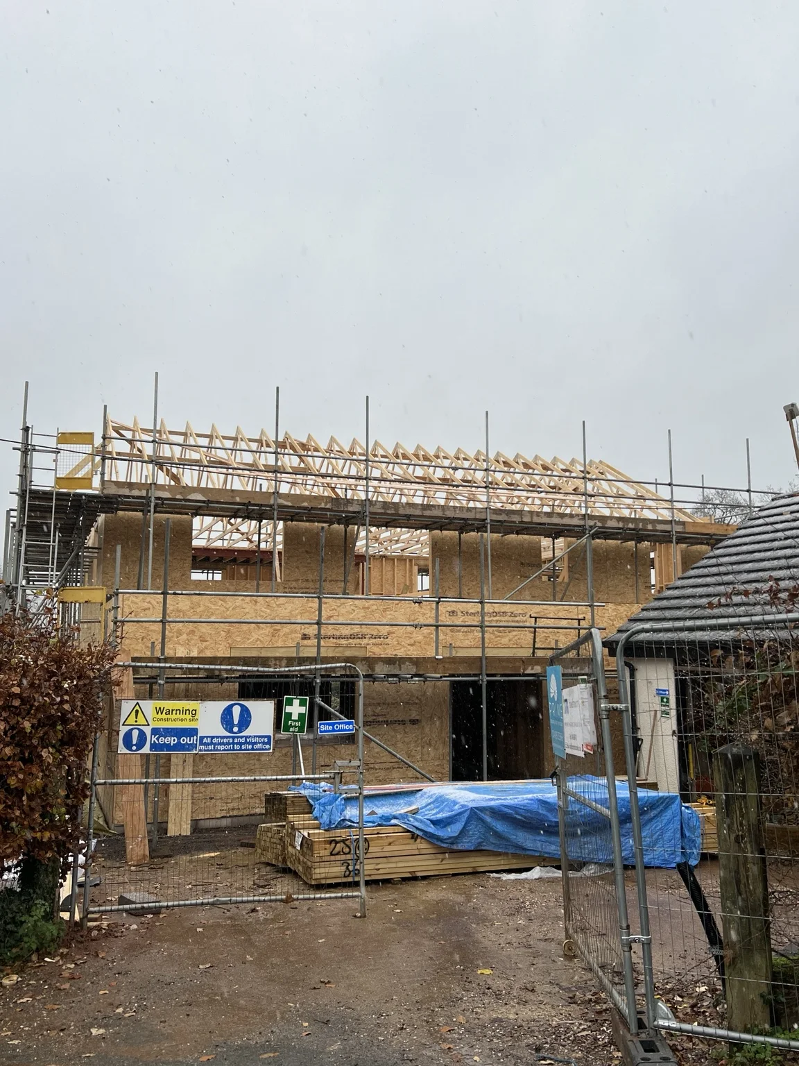 Timber frame building with roof trusses in place